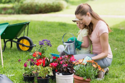 Worker using appropriate protective equipment while gardening